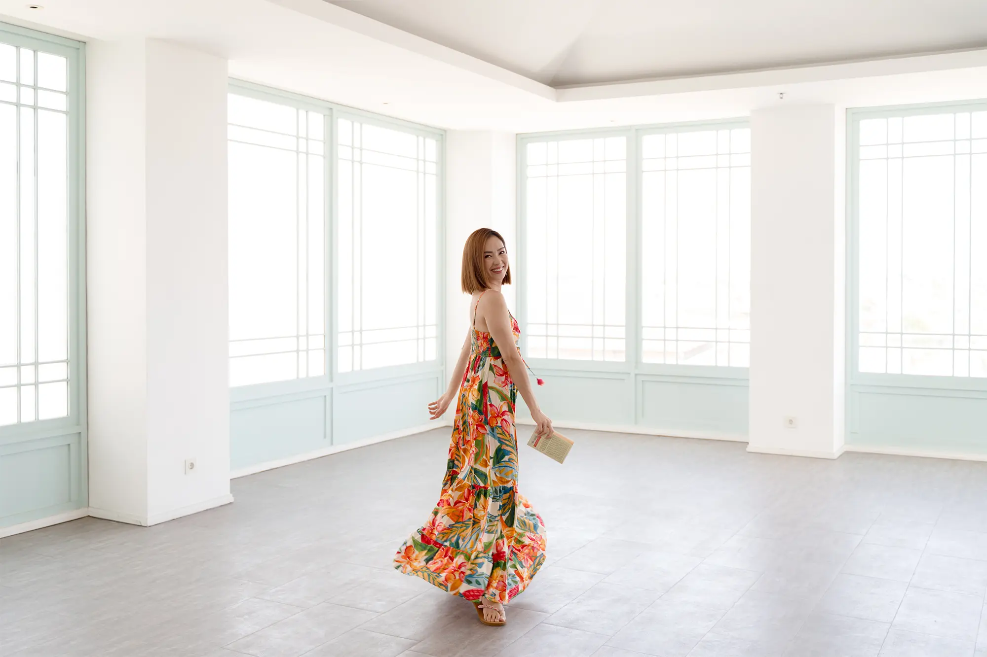 Iriana Halim (Youyi), founder of Inside Out Academy Singapore and executive presence & presentation coach, walking in a beautiful space