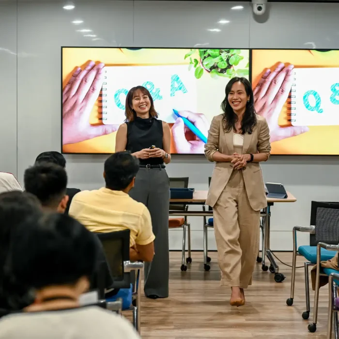 Iriana Halim (Youyi) and Julina Halim (Youhui), the founders of Inside Out Academy, speaking to the attendees of their workshop in Singapore